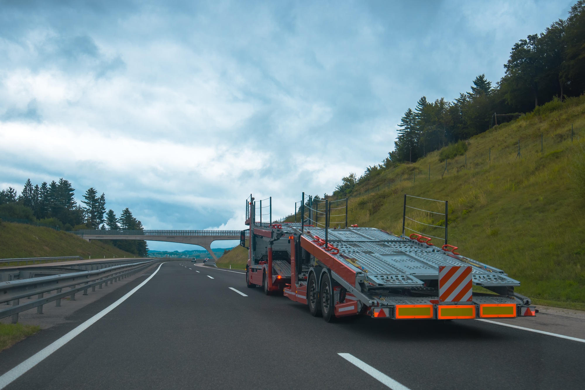 Semi truck with car carrier trailer